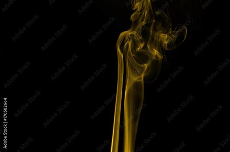 Gold smoke on black background,movement of gold smoke, Abstract gold ...