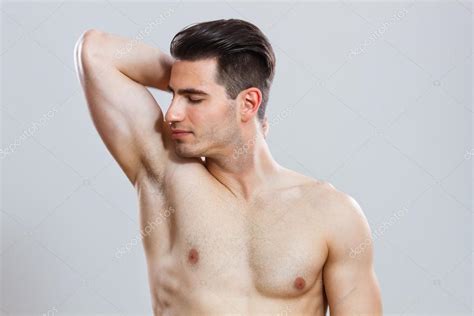 Man smelling his armpit — Stock Photo © inesbazdar #72775807