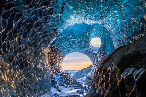 Vatnajokull National Park in Jokulsarlon, Iceland. An ice cave in a glacier reflecting the ...