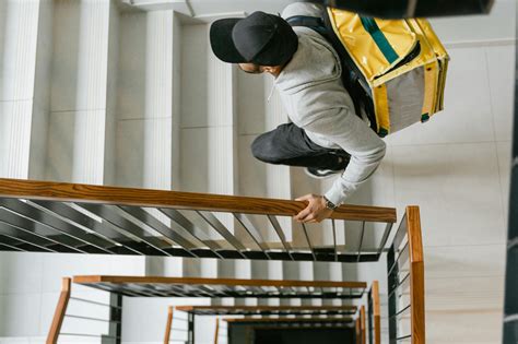 Deliveryman Going Up the Stairs · Free Stock Photo