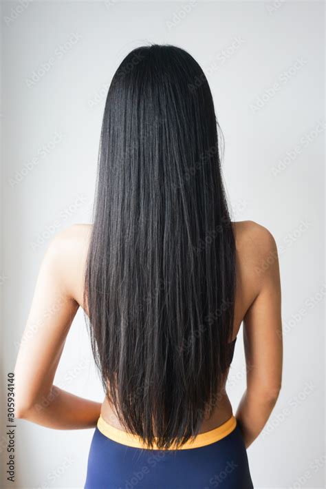 Back view of woman with beautiful long straight black hair. Stock Photo ...