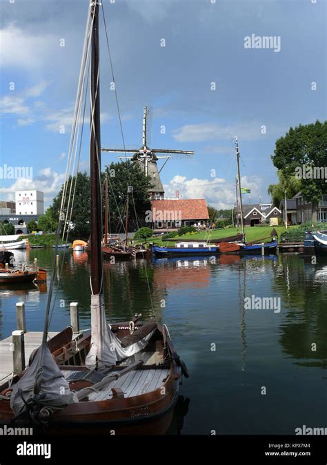 Port and windmill of Harderwijk/Netherlands Stock Photo - Alamy