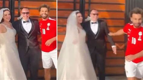 Watch Mo Salah casually gatecrash bride and groom's wedding photo in full Egypt kit then jog off ...