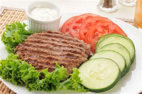 Grilled ground beef patty stock photo. Image of carbs - 25838736