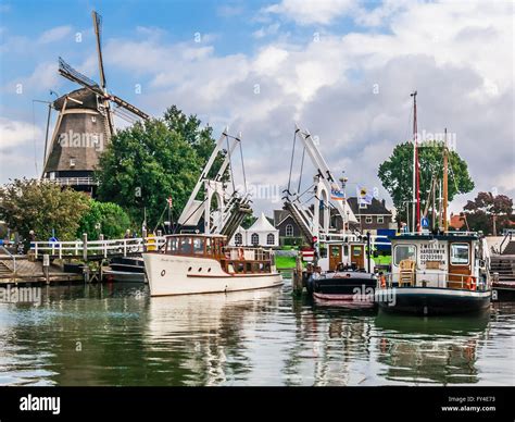 Windmill, bridge and boats in the harbour of Harderwijk in de Stock Photo: 102746535 - Alamy