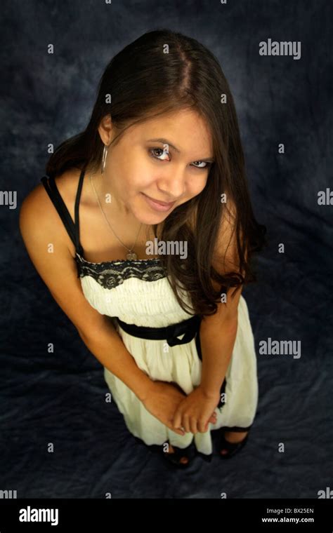 A pretty Filipino American woman with long brown hair Stock Photo - Alamy