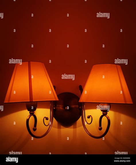 An elegant antique lamp on a dark red background Stock Photo - Alamy