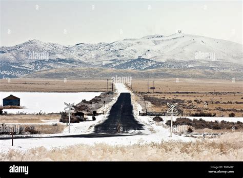 Snow Covered Railroad Crossing Stock Photo - Alamy