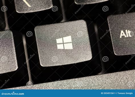 Microsoft Windows 10 Operating System Logo Key on a Black Desktop ...