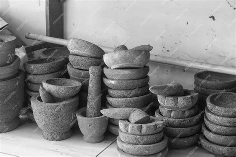 Premium Photo | A collection of pottery including a mortar and pestle.