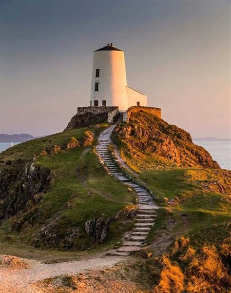 A lighthouse on Llanddwyn Island, a small tidal island off the west ...