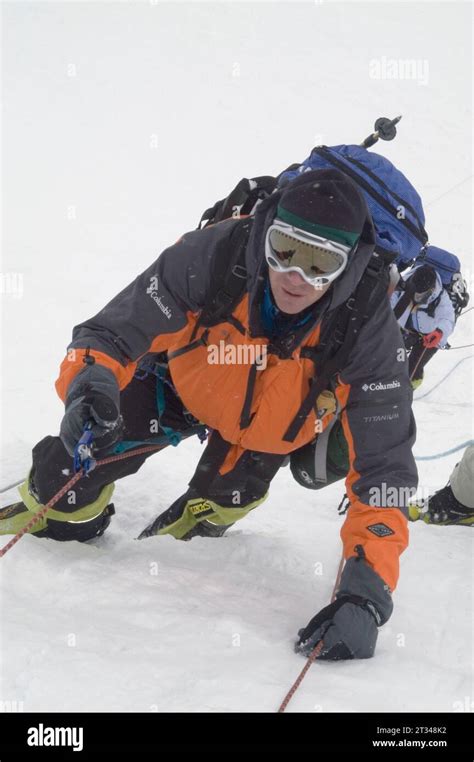 Man climbing Everest Stock Photo - Alamy