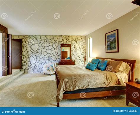 Beautiful Bedroom Interior with Rock Wall Stock Image - Image of inside ...