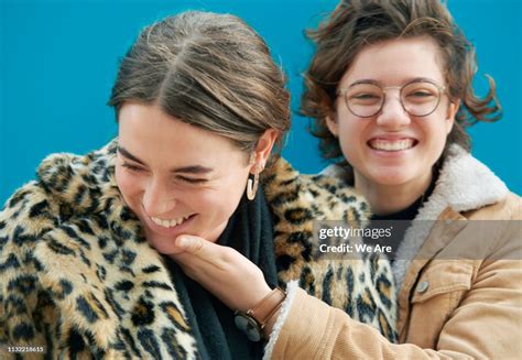 Two Women Laughing Together High-Res Stock Photo - Getty Images