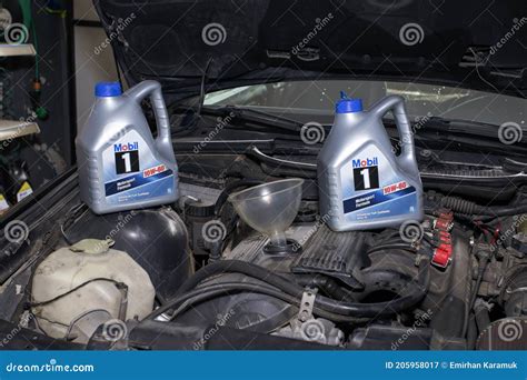 Pouring oil to car engine. editorial photography. Image of machine - 205958017