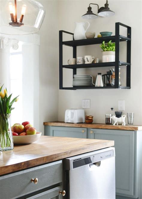 Shallow upper cabinets are used as base cabinets (genius!), creating a low-profile coffee ...