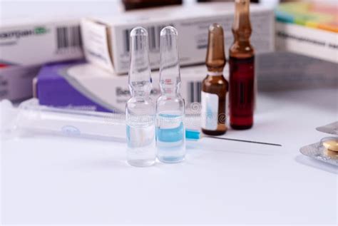 Ampoules for Injections Against the Background of Packs with Medicines. Medical Concept Stock ...