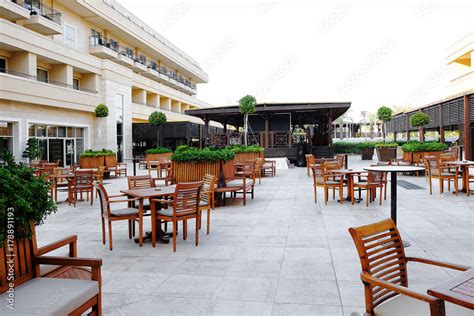 Outdoor cafe with chairs and tables Stock Photo | Adobe Stock