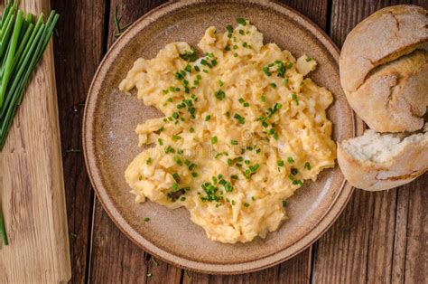 Scrambled eggs with herbs stock image. Image of food - 102882009