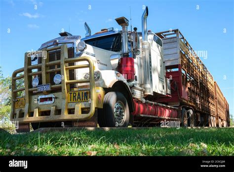 A Kenworth Road Train truck parked on the side of the road in the ...