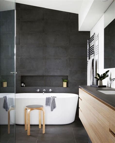 Home Beautiful on Instagram: “Practical and stylish, this modern bathroom embraces a moody p ...