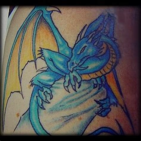 Blue hydra dragon on stone tattoo - Tattooimages.biz