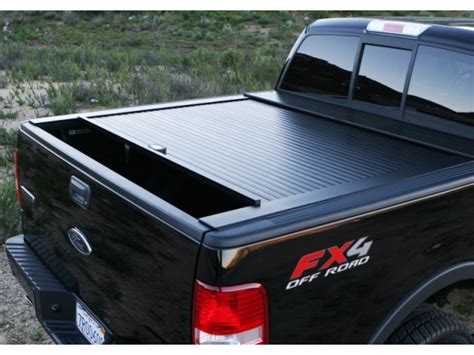 Roll-in-lock retractable truck bed cover for ford