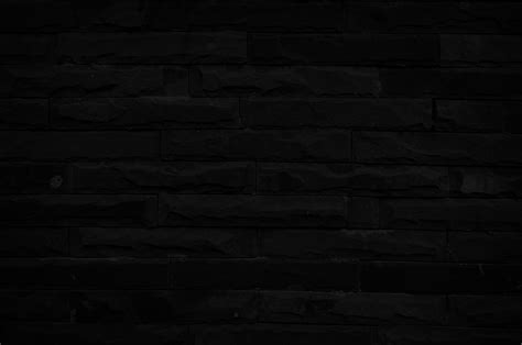 Old black brick wall texture for background with copy space for design ...