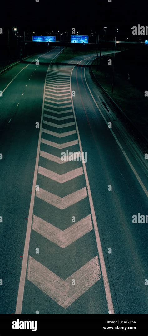 CHEVRON ROAD MARKING AT NIGHT UK Stock Photo - Alamy