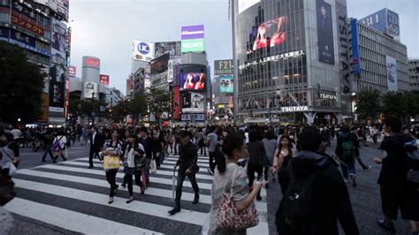 A Busy Crosswalk In Tokyo Japan Is Swarming Stock Footage SBV-324553697 - Storyblocks