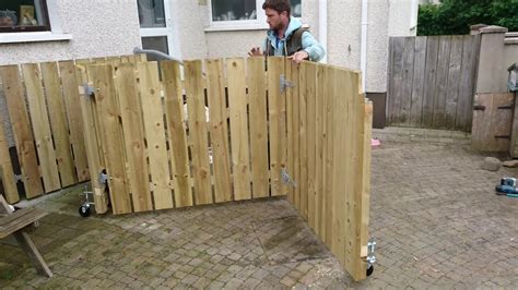 Bi-folding wooden gates - YouTube