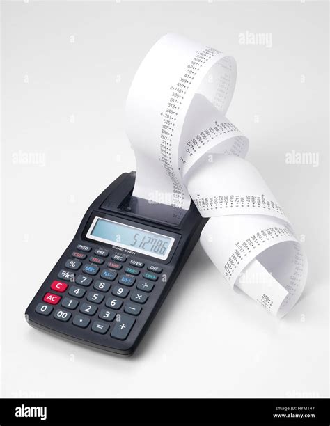 Calculator with roll of adding machine tape Stock Photo - Alamy