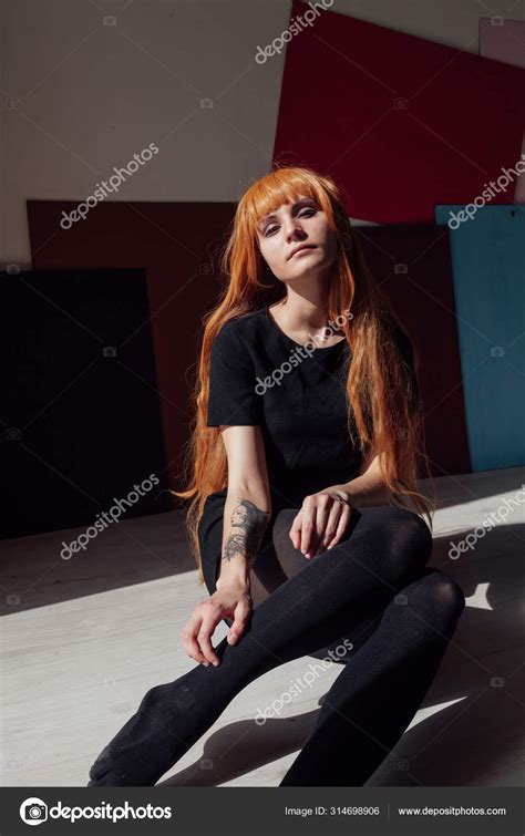 Girl cosplayer with red hair anime Japan — Stock Photo © dsimakov-foto.mail.ru #314698906