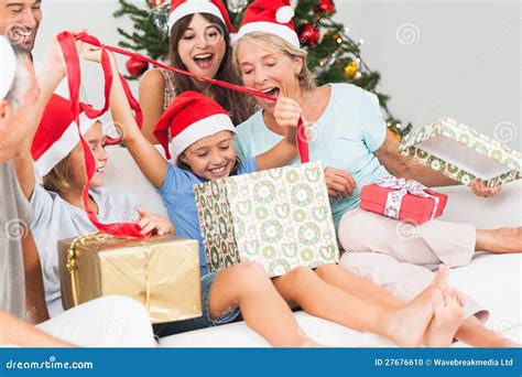 Happy Family At Christmas Opening Gifts Together Stock Photo - Image ...