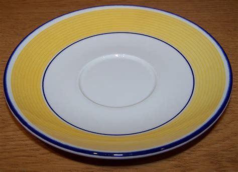 File:Saucer with yellow and white design.jpg - Wikimedia Commons