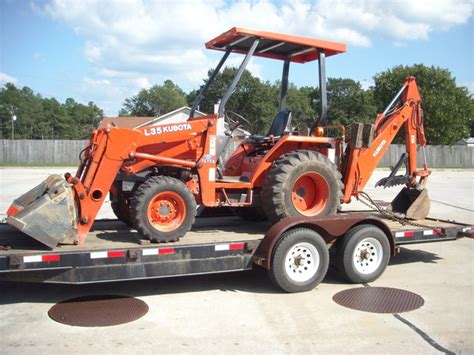 Kubota L35 tractor backhoe with MT824 mini thumb by USA Attachments #mt824