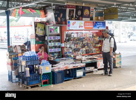 hong kong newspaper street stand Stock Photo - Alamy