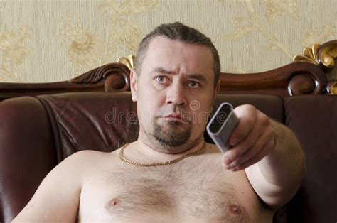 Man with a TV Remote Control Stock Image - Image of white, remote: 70798053
