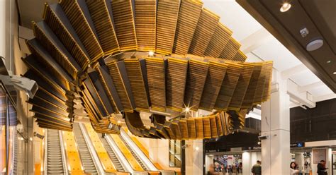 5 tons of vintage wooden escalator warped into spectacular subway sculpture