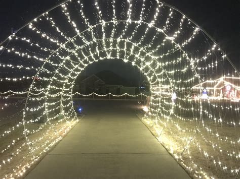 Our driveway Christmas light tunnel. 24’ long. It’s a trip to drive thru when it’s pulsing to ...