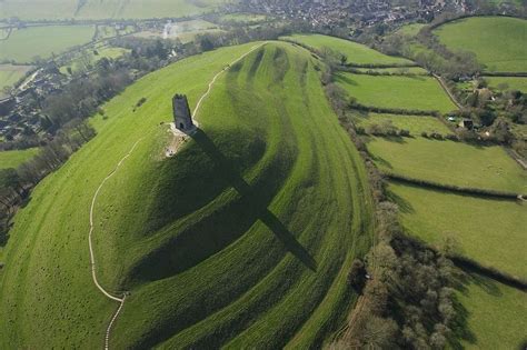 Glastonbury Tor is a large hill located in Glastonbury, Somerset, England, with a roofless St ...