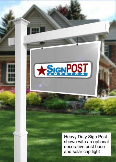 a real estate for sale sign in front of a house with the words, heavy ...