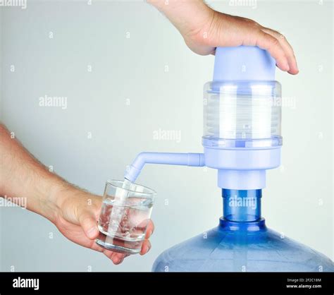 Hand water pump. Water pump for home and office use. Drinking Water bottles with manual pump ...