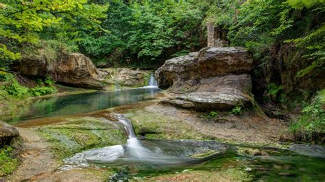 Tranquil Forest Stream: A 4K Ultra HD Waterfall Wallpaper