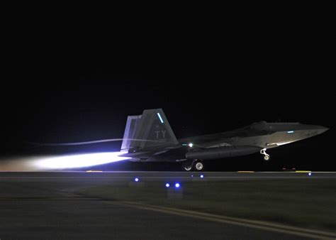 The Aviationist » Stunning photos of the F-22s departing at night from Tyndall AFB for their ...