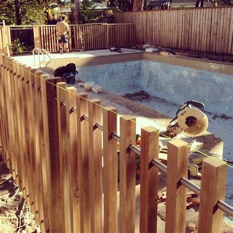 Modern timber pool fence - 40x40mm battens with steel rail | Diy pool ...