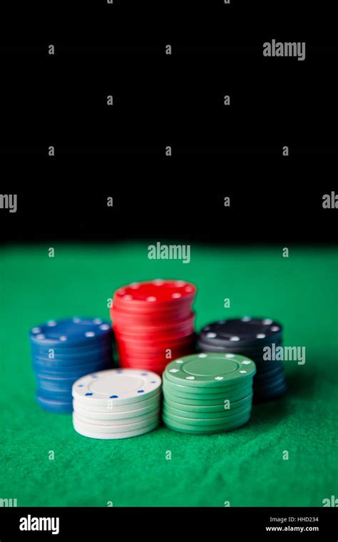 Gambling chips against a black background Stock Photo - Alamy