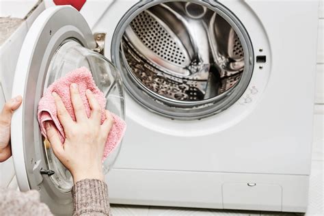 Hand pours liquid detergent into the washing machine - Creative Commons ...