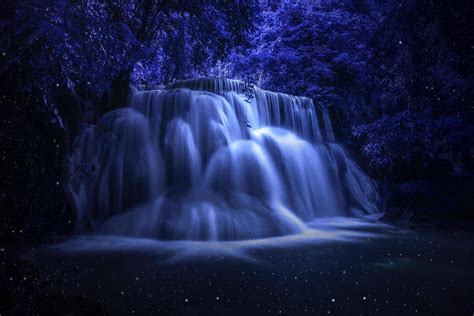 Beautiful waterfall nature scenery of colorful at a night deep tropical ...