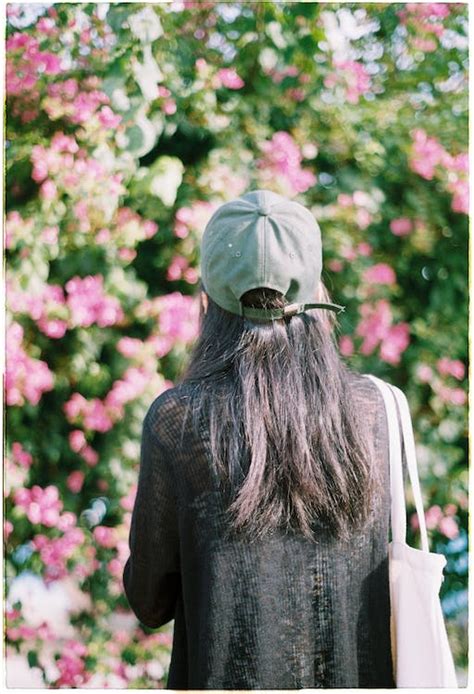 A Woman Wearing a Cap · Free Stock Photo